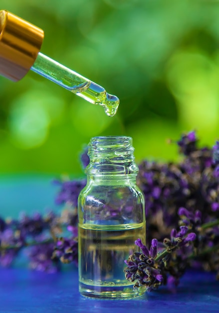 Lavender essential oil in a bottle. Selective focus.