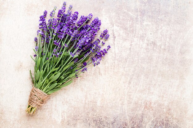 Lavender flowers, bouquet on rustic background, overhead.