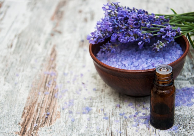 Lavender and massage salt on a old wooden background