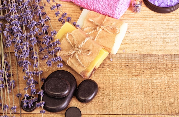 Lavender soap and salt on rustic wooden board Spa concept