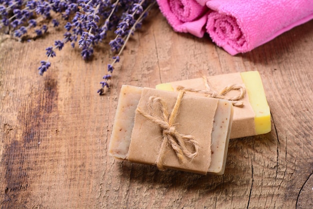 Lavender soap and salt on rustic wooden board Spa concept