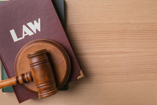 Law book and gavel on table Legal immigration