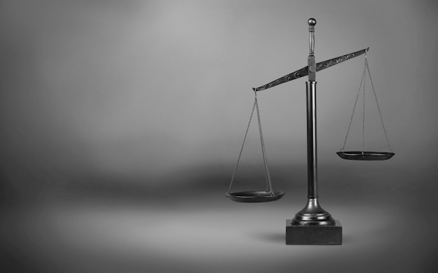 Law scales on table background. Symbol of justice