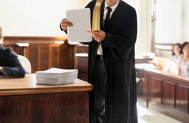 Photo lawyers use a pen to point out a blank piece of paper to point out legal documents