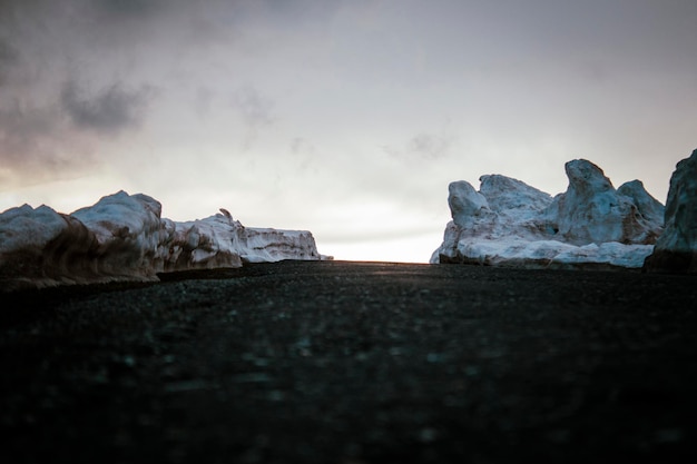 Layer of snow on the asphalt road