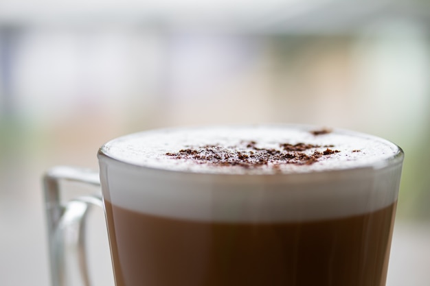 Layered cappuccino in a glass mug