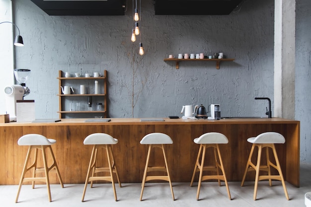 Layout in a loft style in dark colors open space interior view of various coffee Welcome open coffee shop background