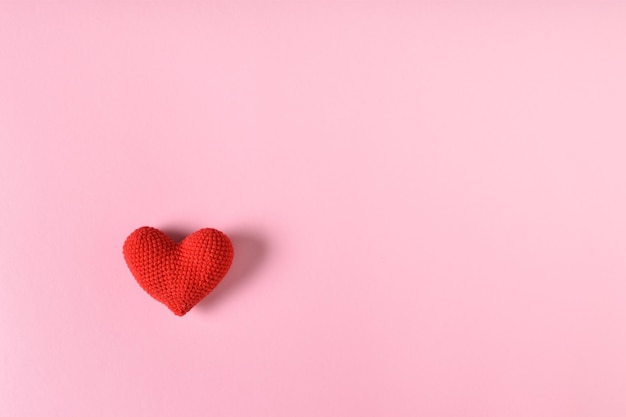 The layout of a Valentine's Day greeting card with hearts on a pink background Copy space Flat lay top view