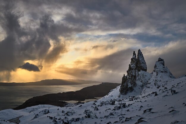 Ld Man Storr, Isle Skye, Scotland. Winter, very snowy mountain in a very powerful sunrise with some