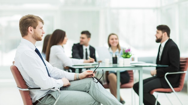 Leading lawyer of the company on the background of the working meeting the business team