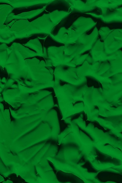 The leaky texture of the green paint Smudged paint is a liquid green color Background green color lunge spreading in the light Applied to the surface grassy natural