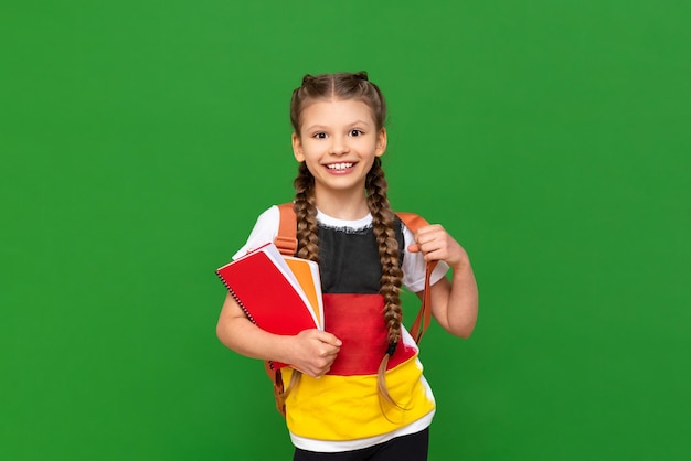 Learning German a schoolgirl with a textbook and an image of the German flag on a Tshirt