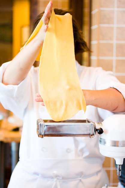 Learning how to make fresh spaghetti from scratch.