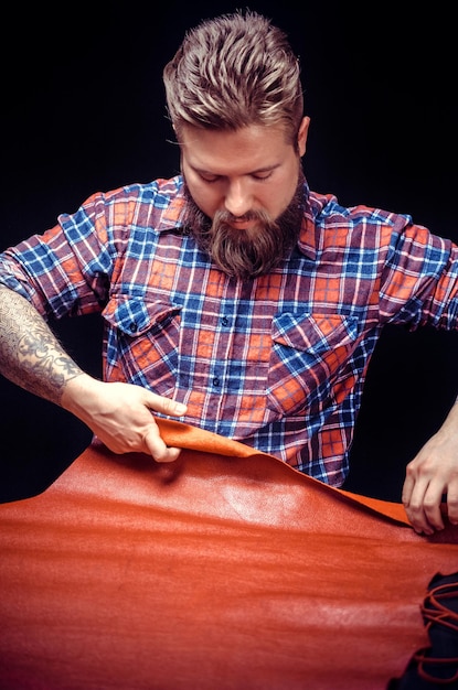 Leather Artist working on a new leather product