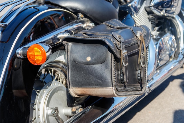 Leather biker bag on a motorcycle close-up. Concept travel on a motorcycle