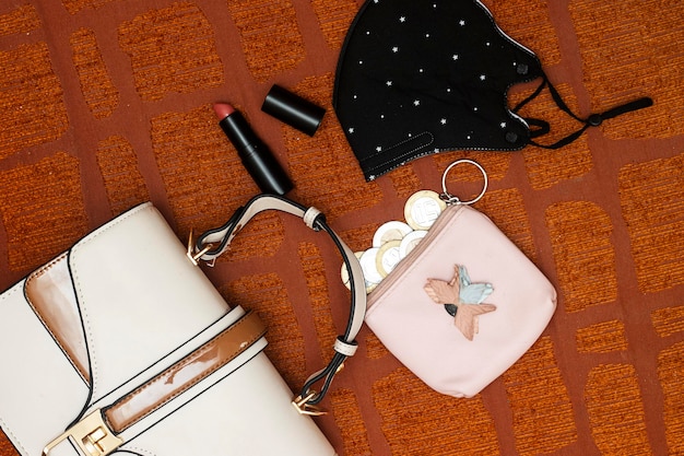 leather shoulder bag and medical mask money wallet and lipstick