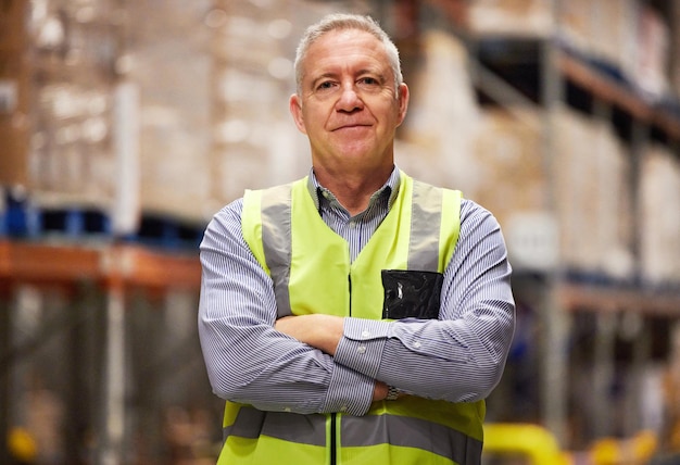 Leave it to the logistical specialist Portrait of a mature man working in a warehouse