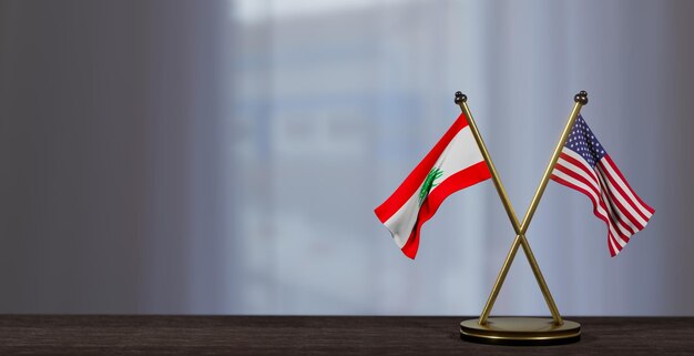 Photo lebanon and usa flags on table negotiation between lebanon and united states