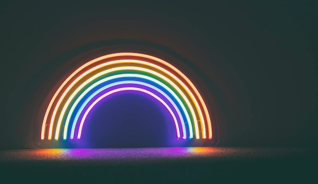 The led neon rainbow shines in the dark room