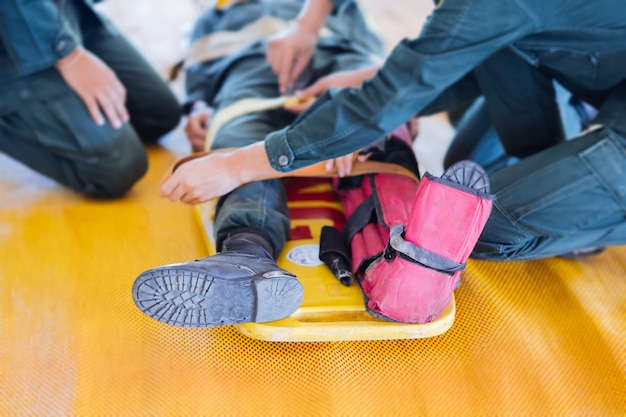 leg fracture to splinters on portable stretcher 