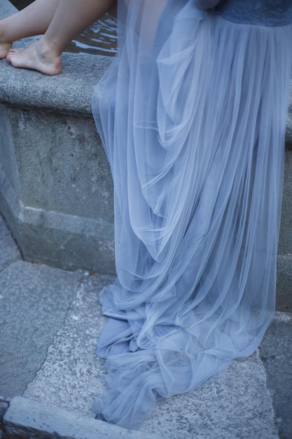 Legs is newlywed on the stone floor. Wedding in Montenegro.