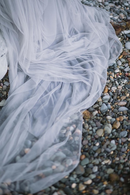 Legs is newlywed on the stone floor. Wedding in Montenegro.