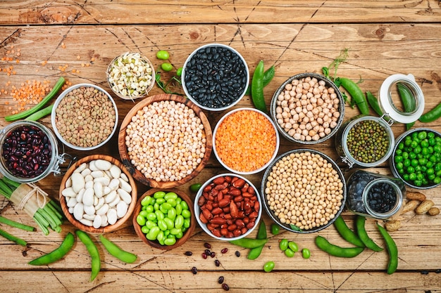 Legumes beans and sprouts Dried raw and fresh top view Lentils mung beans chickpeas soybeans edamame peas Healthy diet food vegan protein micronutrients and fiber sources