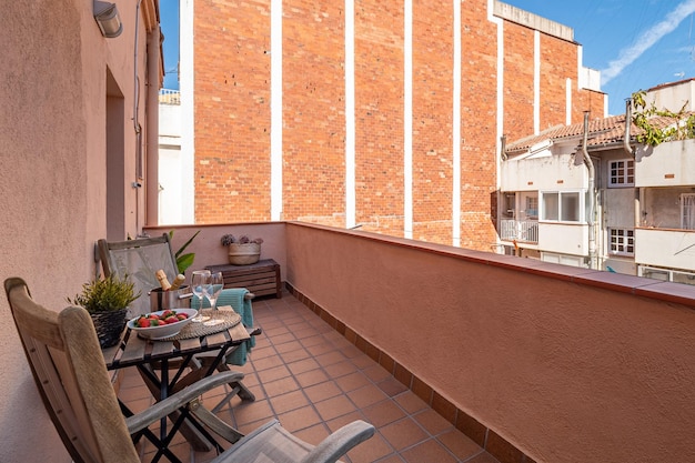 Leisure area on a balcony in a city apartment with buldings around Overbuilding problem concept