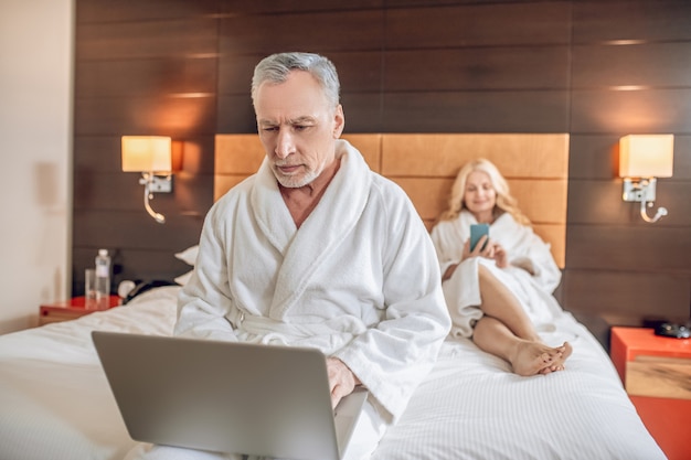 Leisure. Couple in bath robes spending a day together and feeling relaxed