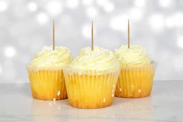 Lemon Cupcake Mockup with Toothpicks atop an Elegant Marble Surface