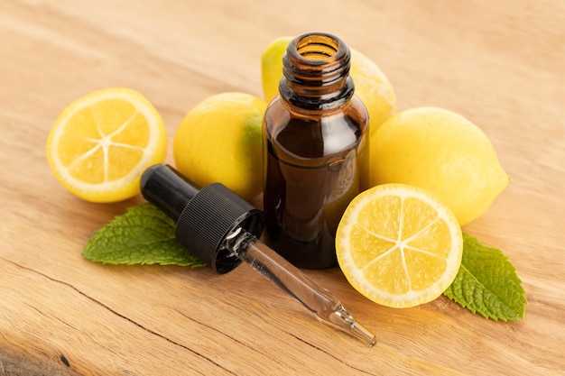 Lemon essential oil on wooden table