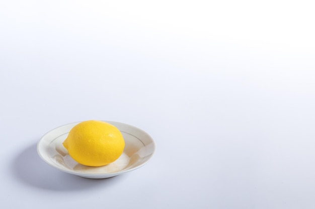 Lemon fruit in plate with white background