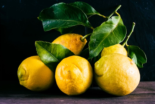 Lemon fruitLemon fruit with leaf isolated Whole lemons on a wooden table