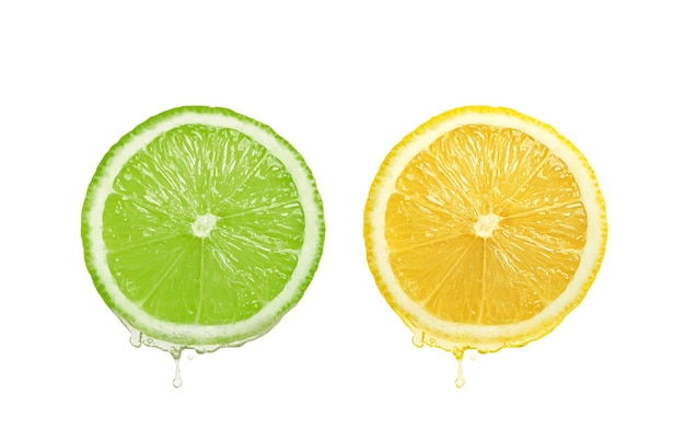 Lemon juice dripping from fruit on white background