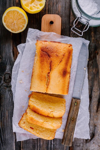 Lemon loaf cake on wooden background Top view