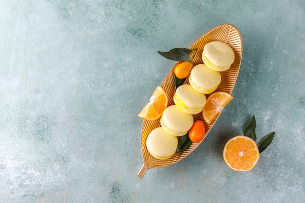 Lemon macaroons with fresh fruits.