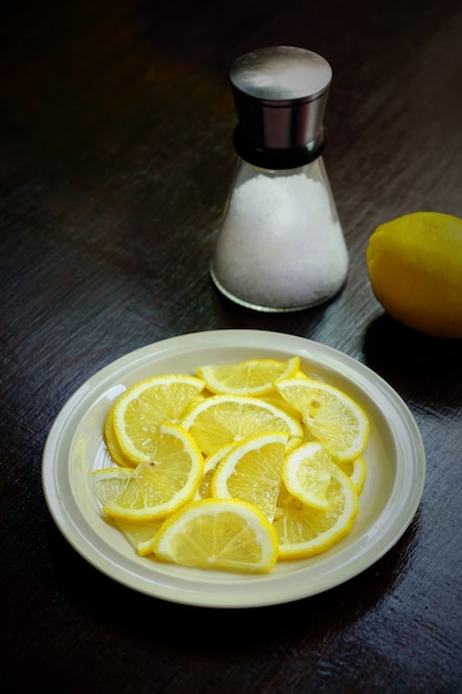 Lemon slice in a white dish.