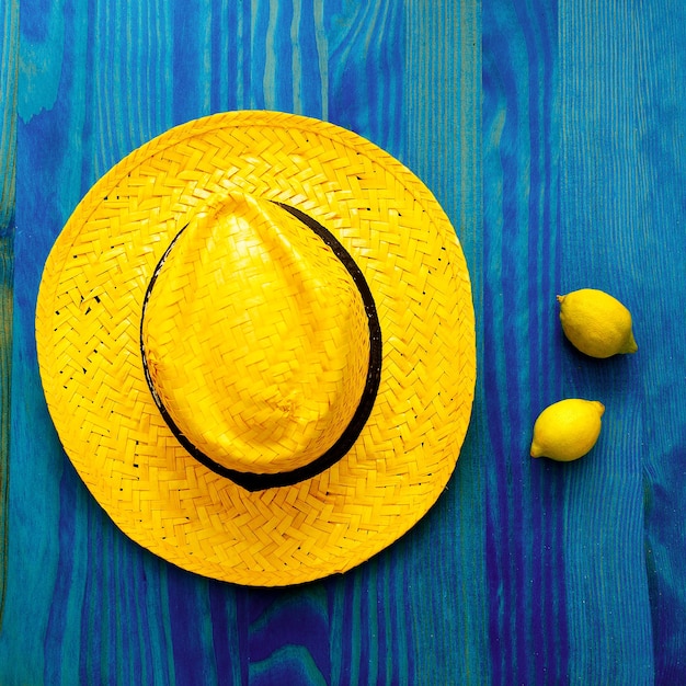 Photo lemon and straw hat. tequila. tropical minimal. fresh ideas