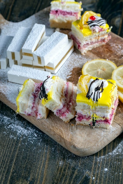 Lemon strawberry cake made of several layers of cakes of different flavors