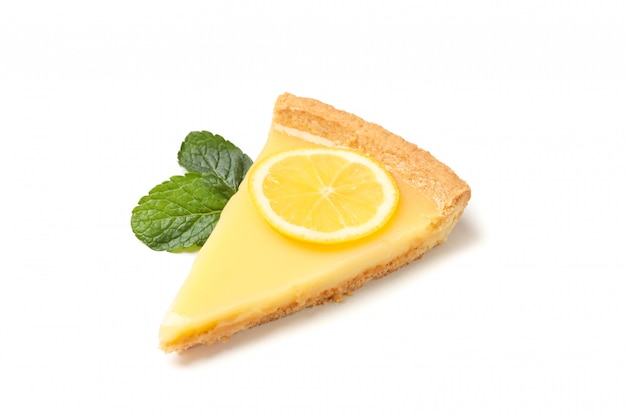 Lemon tart slice and mint isolated on white background