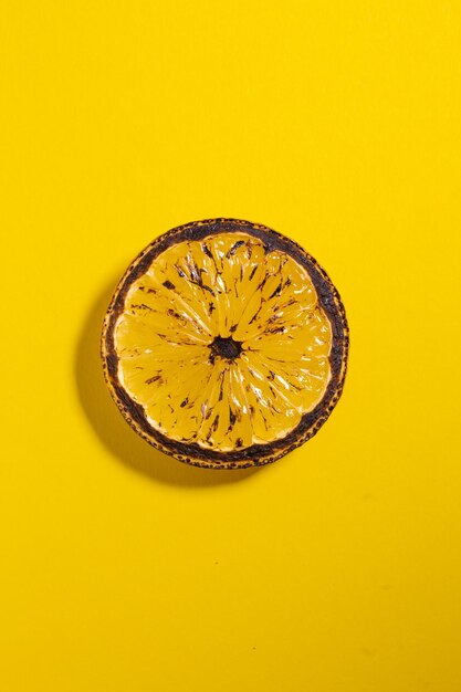 Lemons fruits Juicy slice of lemon on yellow background isolated