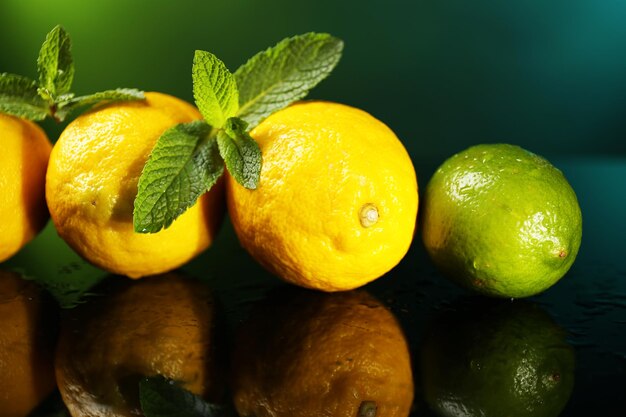 Lemons and lime on dark background