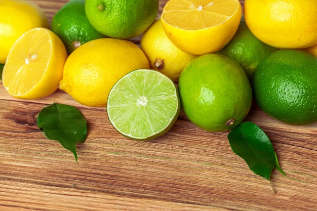 lemons and limes on wooden pad