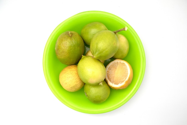 lemons in a plate on a white background