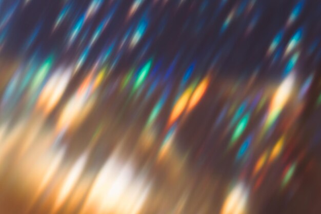 Photo lens flare overlay blur colorful glow optical glare leak party illumination rays defocused orange blue green light flecks on dark night abstract background