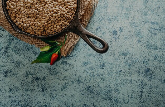 Lentil Beads. Lentil grains in bowl and spoon.