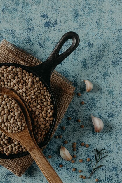 Lentil Beads. Lentil grains in bowl and spoon.