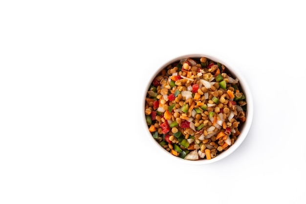 Lentil salad with peppersonion and carrot in a bowl isolated on white background