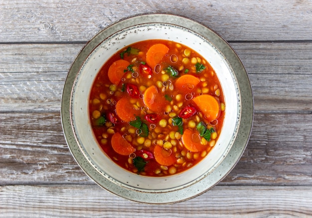 Photo lentil soup with carrots and pepper. recipes. german cuisine.