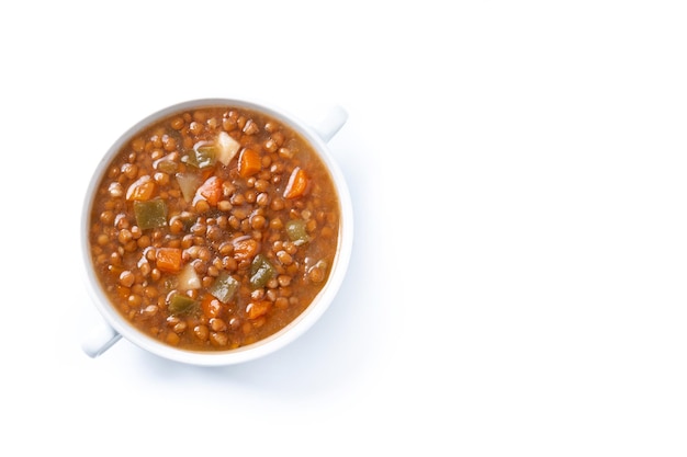 Lentil soup with vegetables in bowl isolated on white background